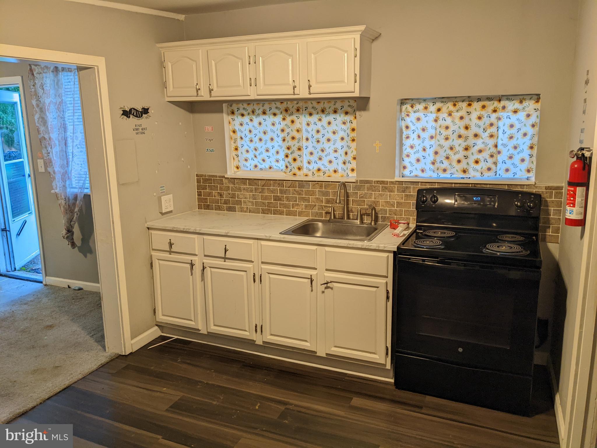 79 Spotts Mill Road Douglassville, PA 19518 - Photo 24 of 27 a kitchen with stainless steel appliances a stove and a refrigerator