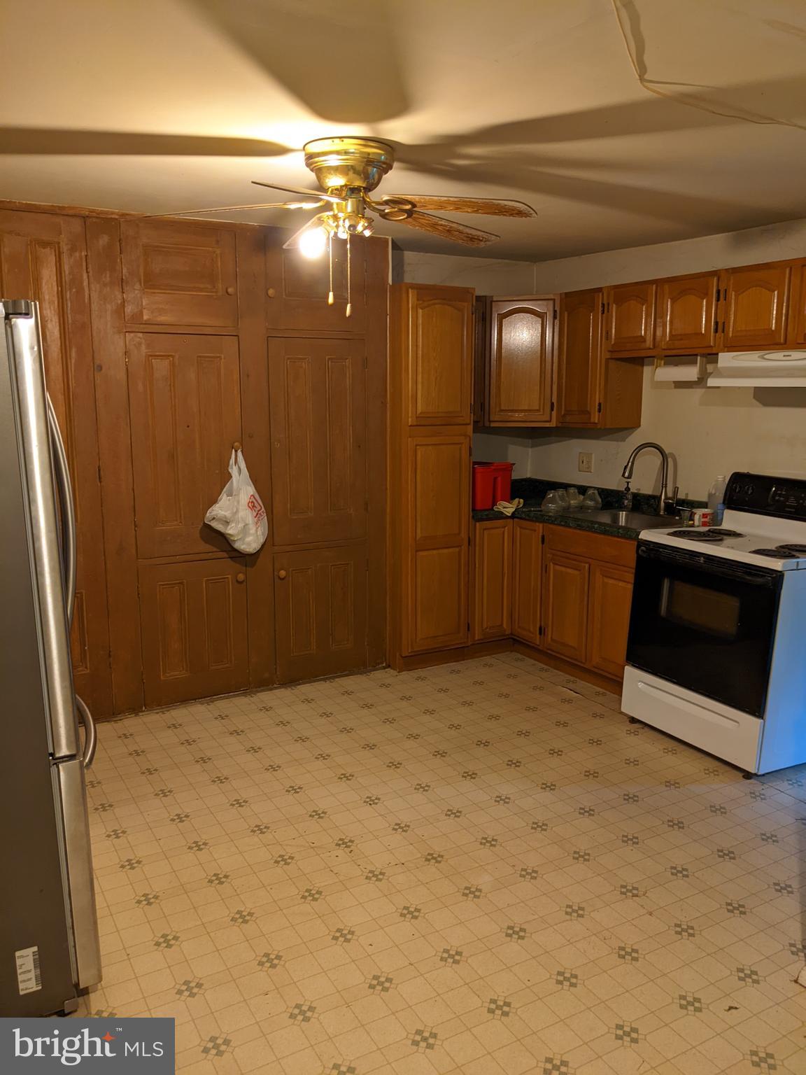 79 Spotts Mill Road Douglassville, PA 19518 - Photo 26 of 27 a kitchen with stainless steel appliances granite countertop a refrigerator and a stove