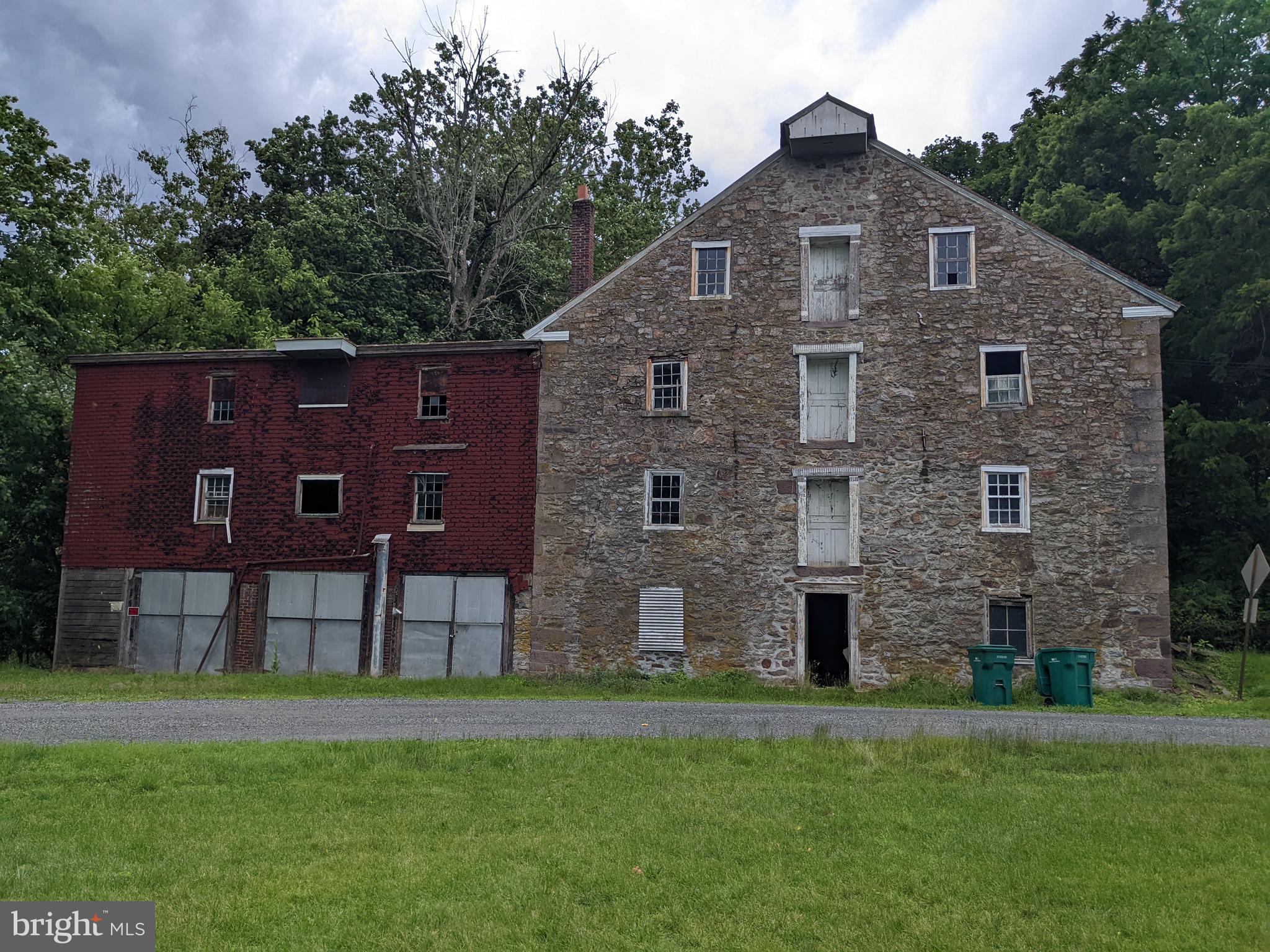 79 Spotts Mill Road Douglassville, PA 19518 - Photo 6 of 27 a brick house with a big yard and big trees