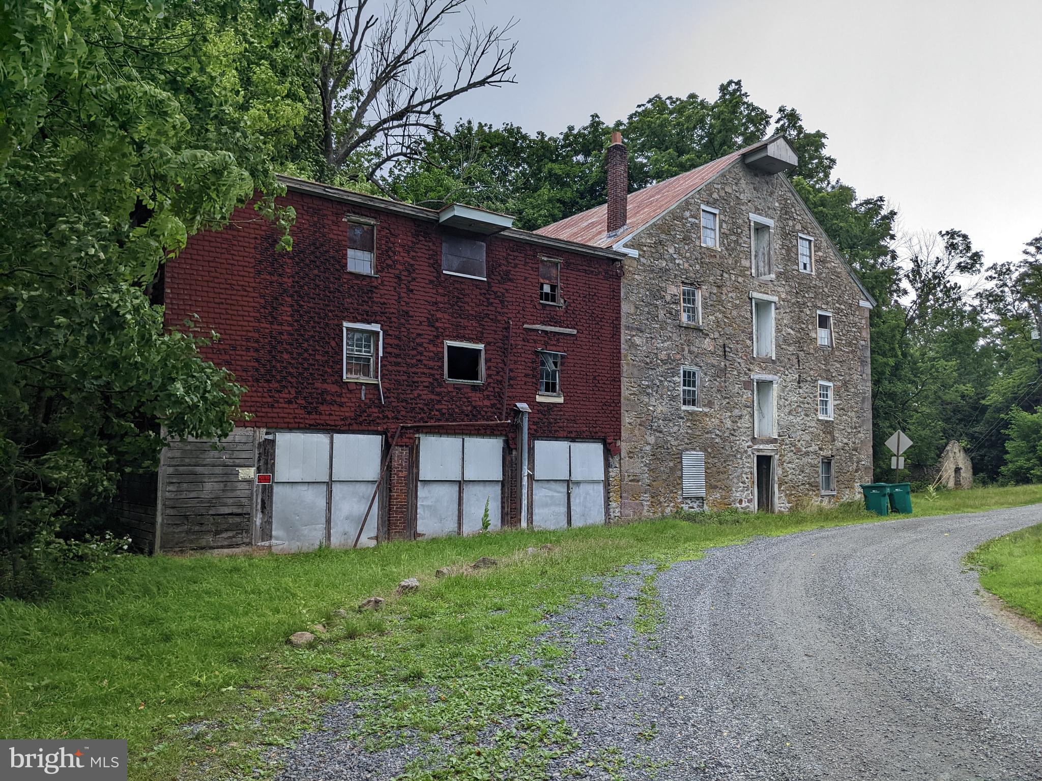 79 Spotts Mill Road Douglassville, PA 19518 - Photo 7 of 27 a brick building with a yard in front of it