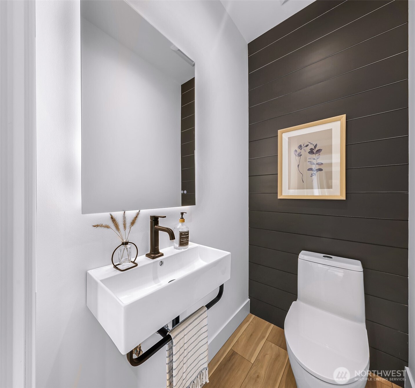 220 Skipping Stone Loop Lynden, WA 98264 - Photo 7 of 26 a bathroom with a toilet a sink and mirror