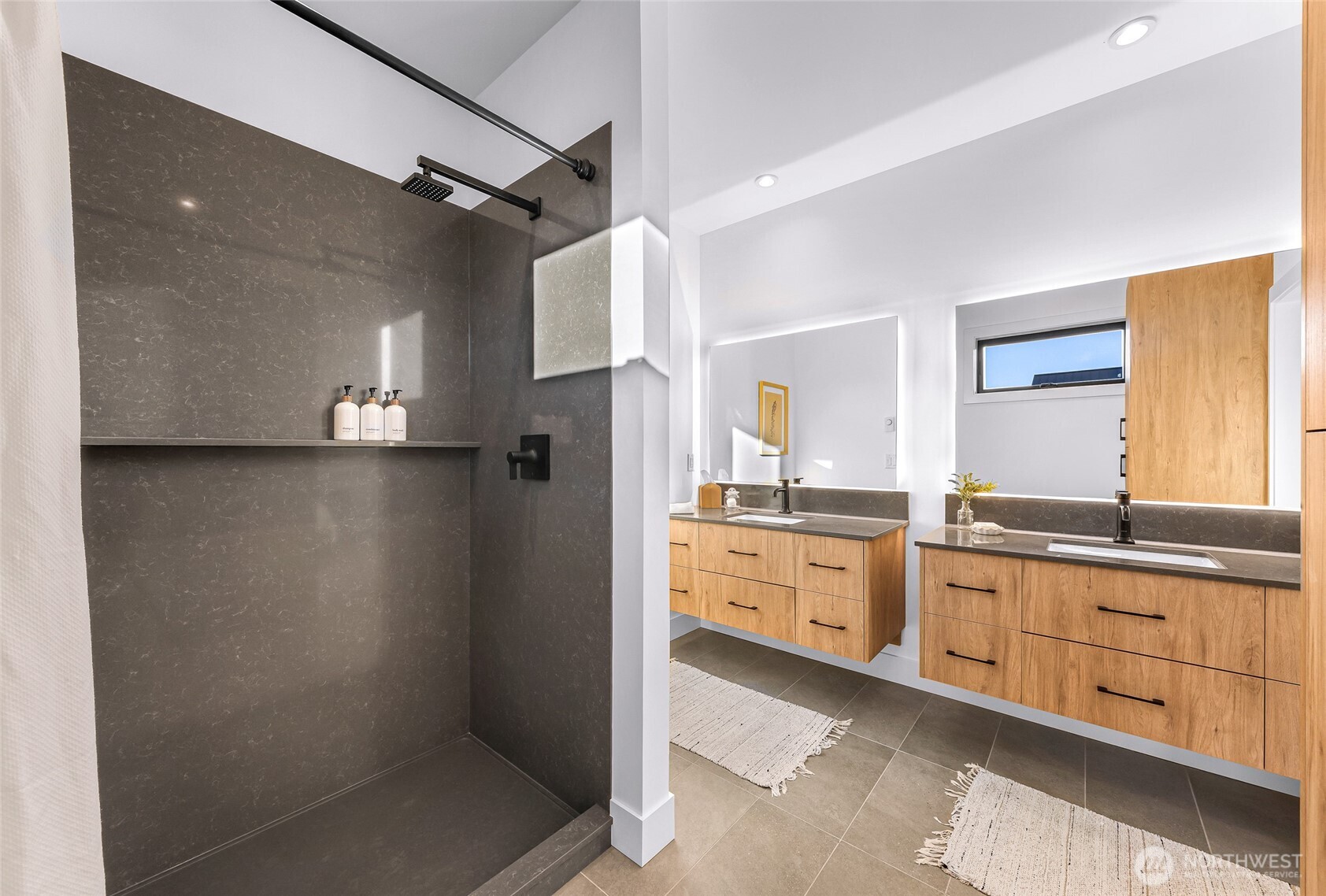 220 Skipping Stone Loop Lynden, WA 98264 - Photo 10 of 26 a large bathroom with a granite countertop sink two mirror and a shower