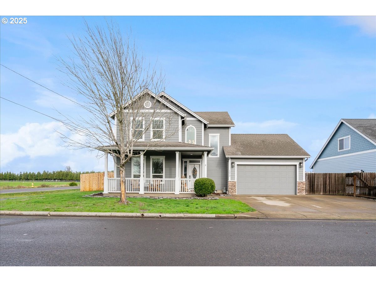 a front view of a house with a garden and pathway