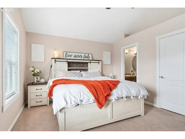 a bed room with a bed and a dresser