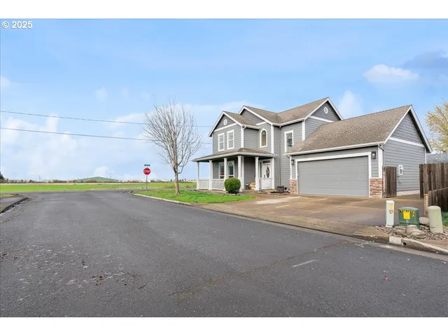 a view of a house with a street