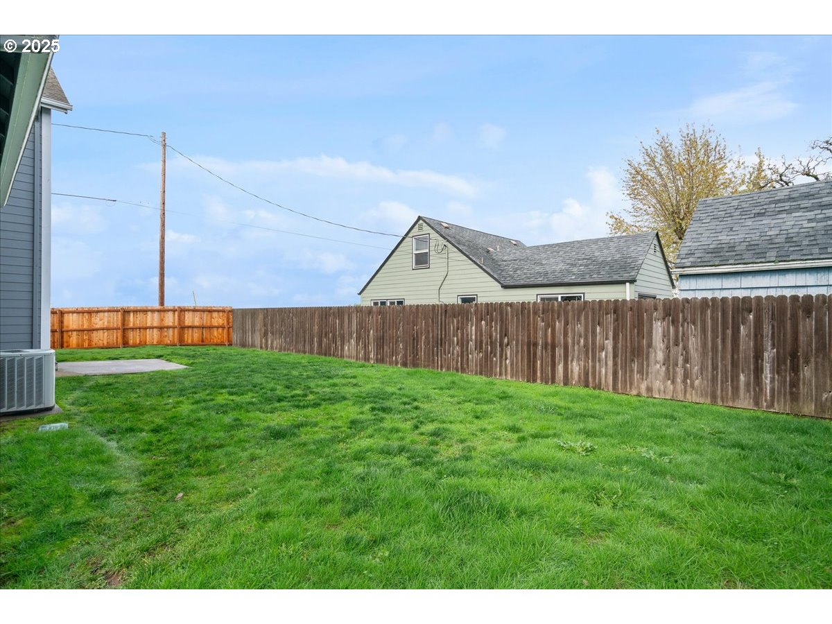 1010 Turtledove Loop Lebanon, OR 97355 - Photo 32 of 36 a view of backyard with wooden fence