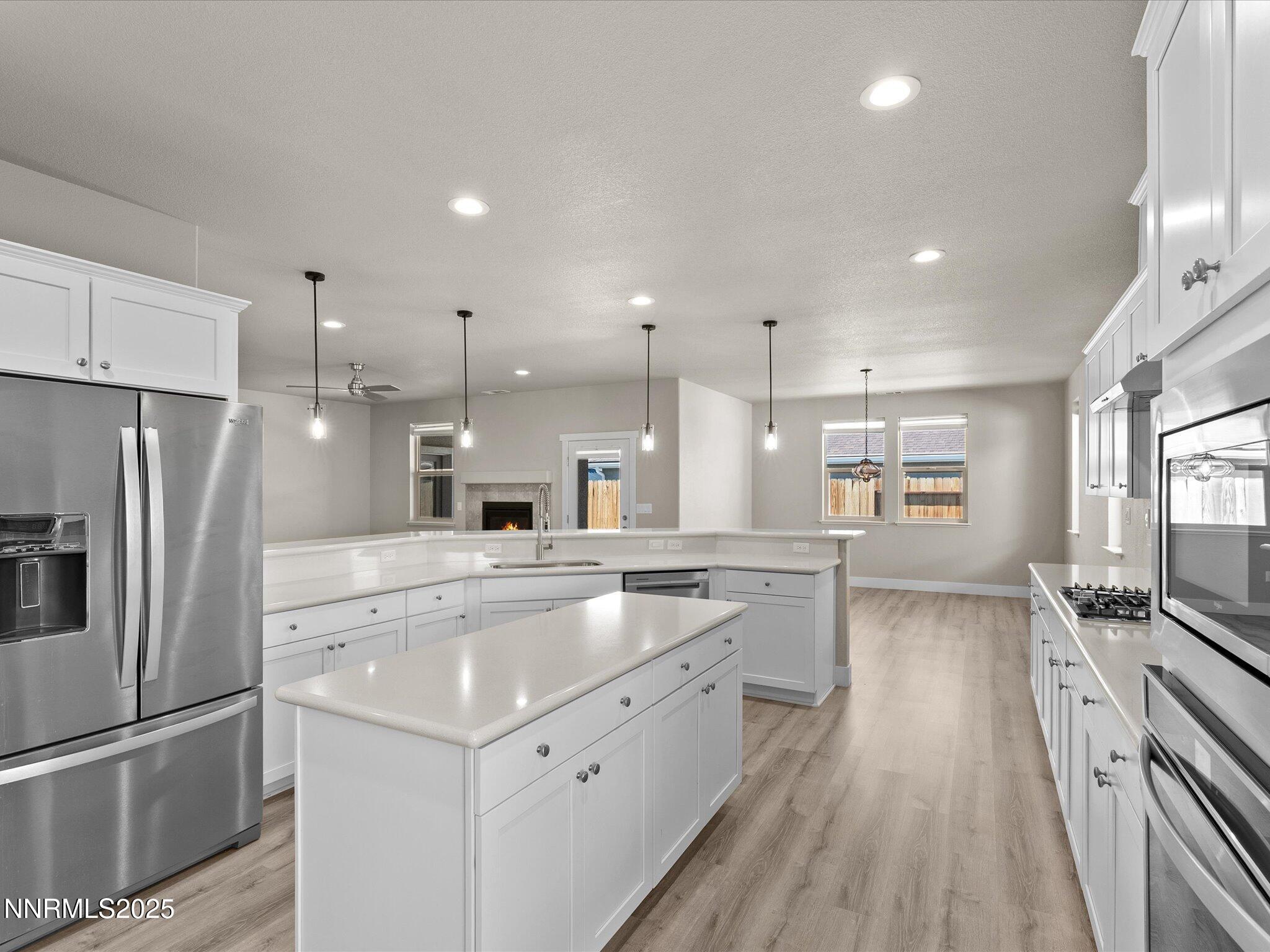 770 East Cottage Loop Gardnerville, NV 89460 - Photo 12 of 38 a kitchen with a sink microwave and refrigerator