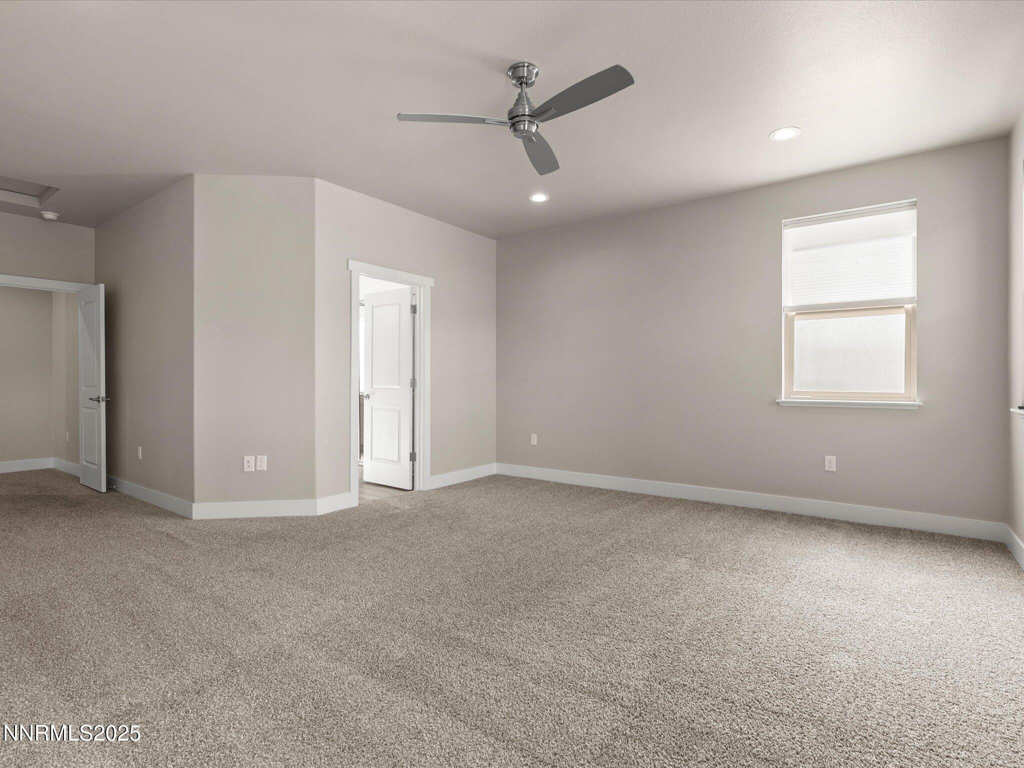 770 East Cottage Loop Gardnerville, NV 89460 - Photo 22 of 38 an empty room with fan and windows