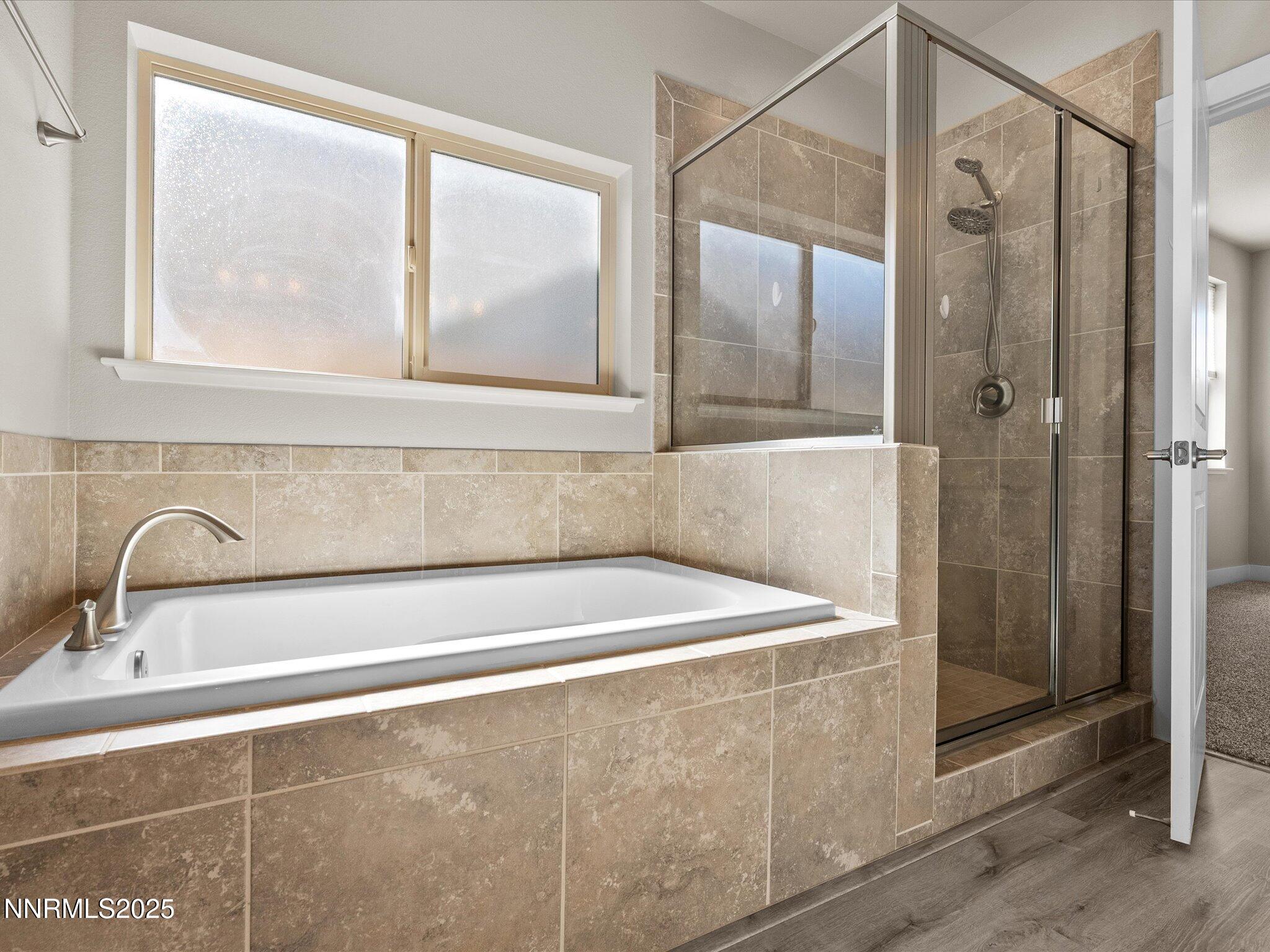 770 East Cottage Loop Gardnerville, NV 89460 - Photo 25 of 38 a bathroom with a bathtub and a shower