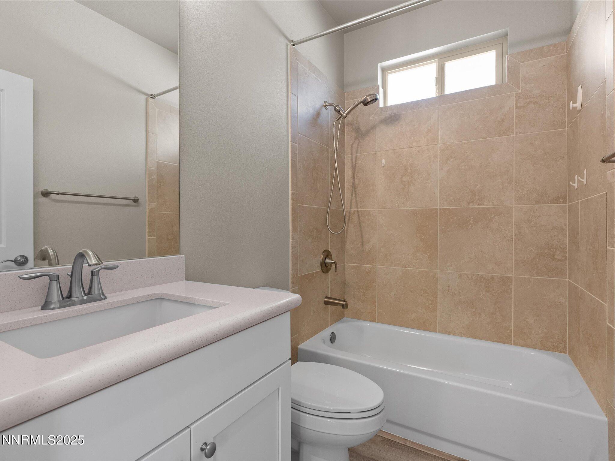 770 East Cottage Loop Gardnerville, NV 89460 - Photo 31 of 38 a bathroom with a sink a toilet and a bathtub