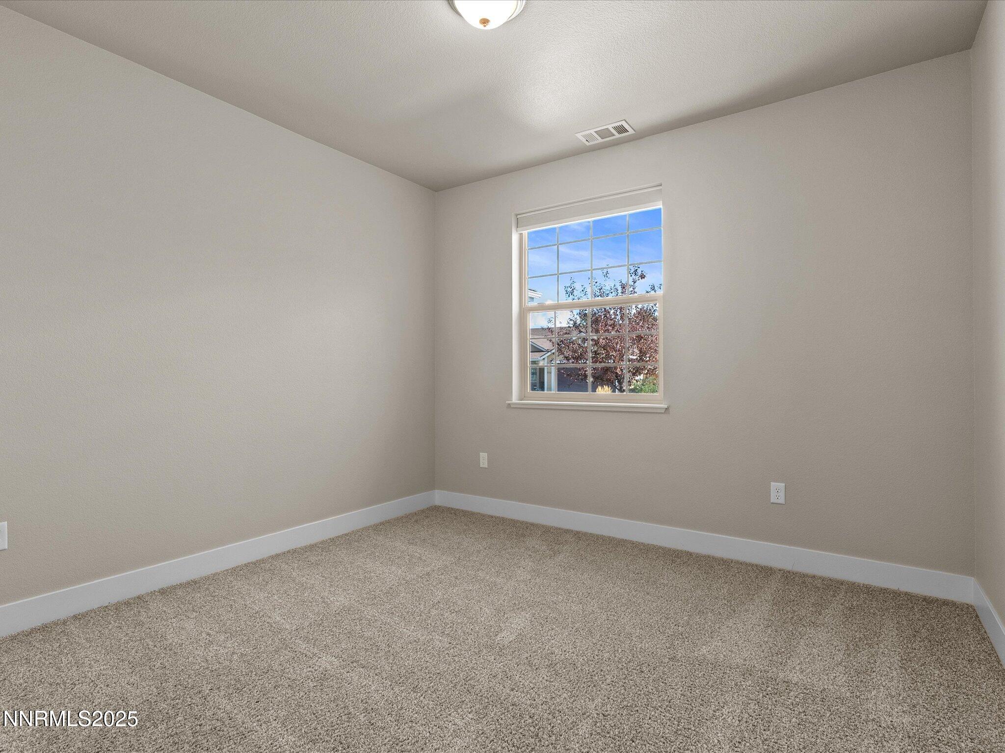 770 East Cottage Loop Gardnerville, NV 89460 - Photo 32 of 38 a view of an empty room with a window