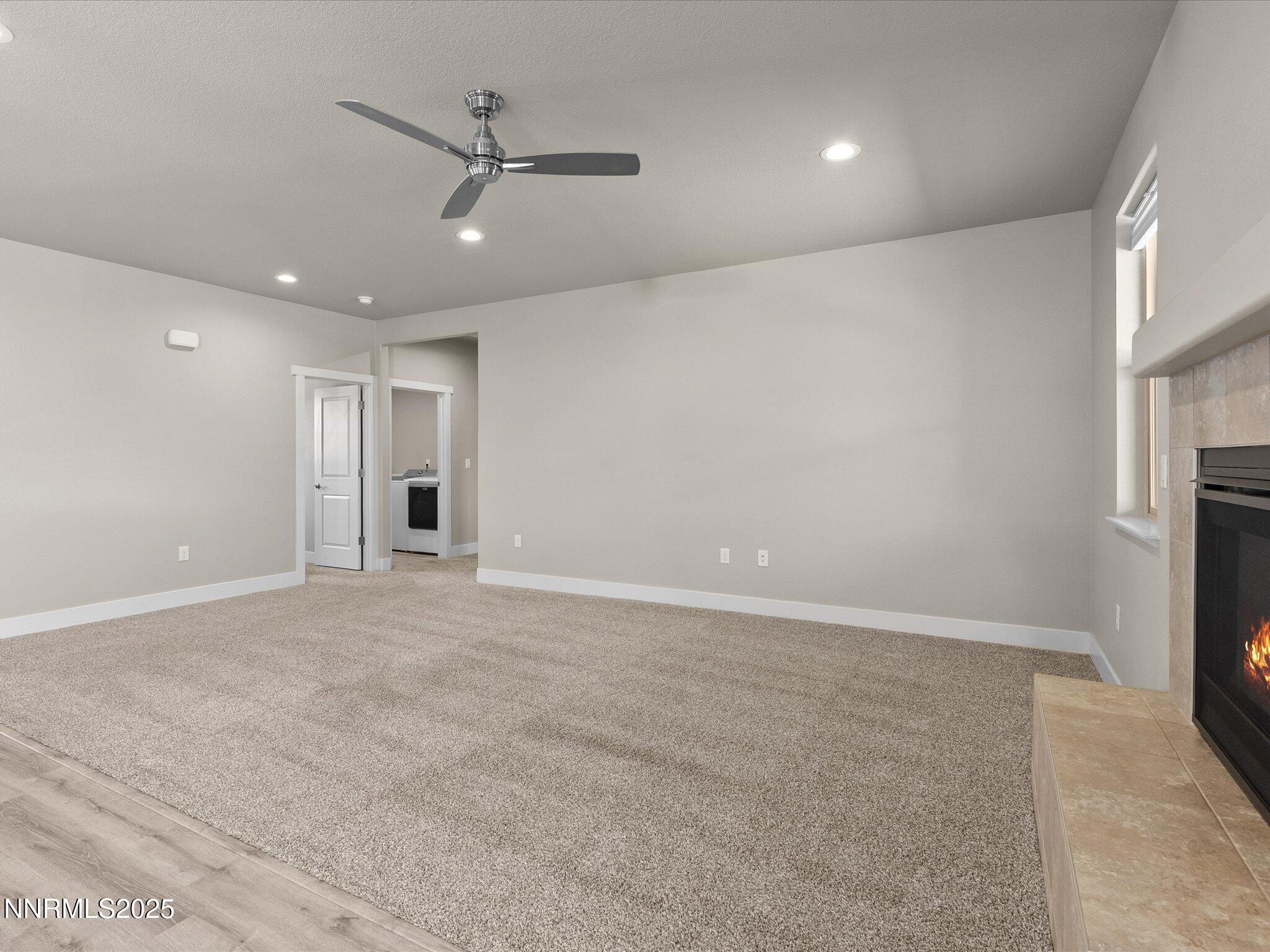 770 East Cottage Loop Gardnerville, NV 89460 - Photo 8 of 38 an empty room with closet and a ceiling fan