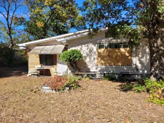 a view of a chair and table in the yard