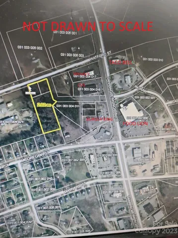 a view of a yard with large trees