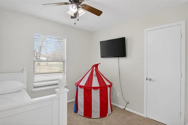 a view of a room with workspace and a window