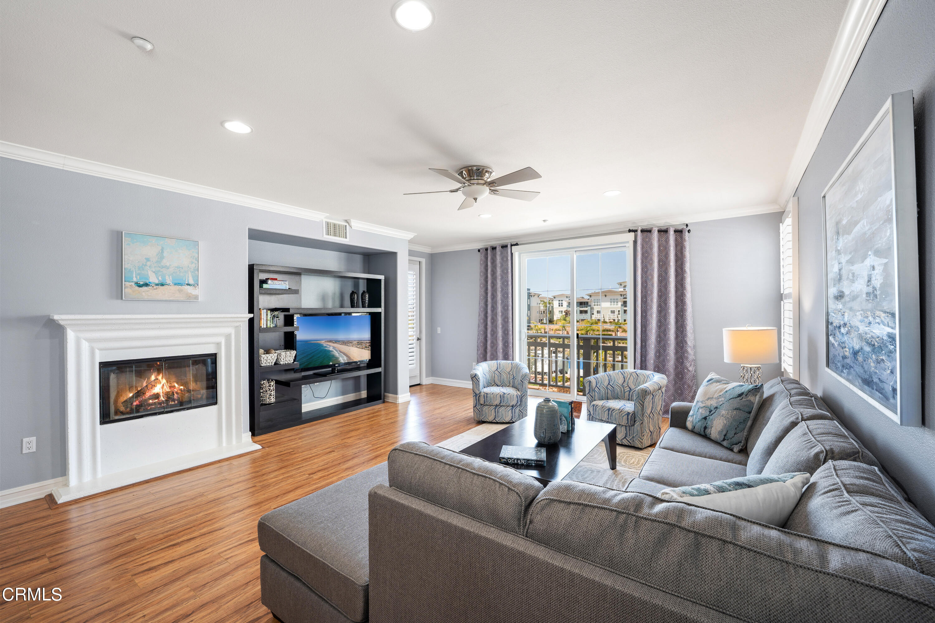 1541 Windshore Way Oxnard, CA 93035 - Photo 14 of 40 a living room with furniture and a fireplace