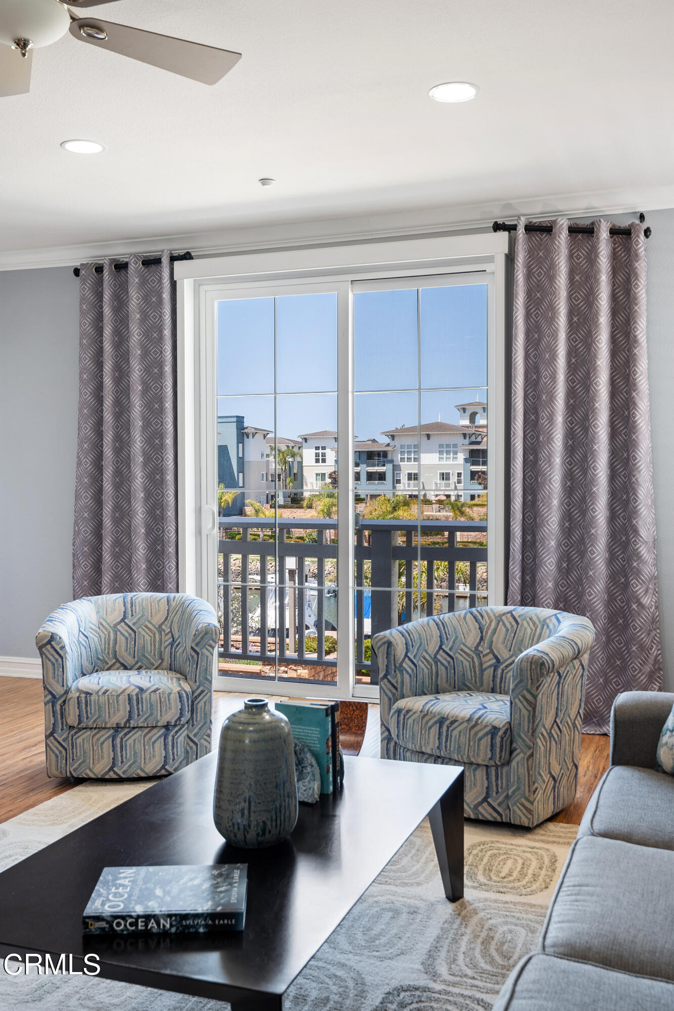 1541 Windshore Way Oxnard, CA 93035 - Photo 15 of 40 a living room with furniture and a large window