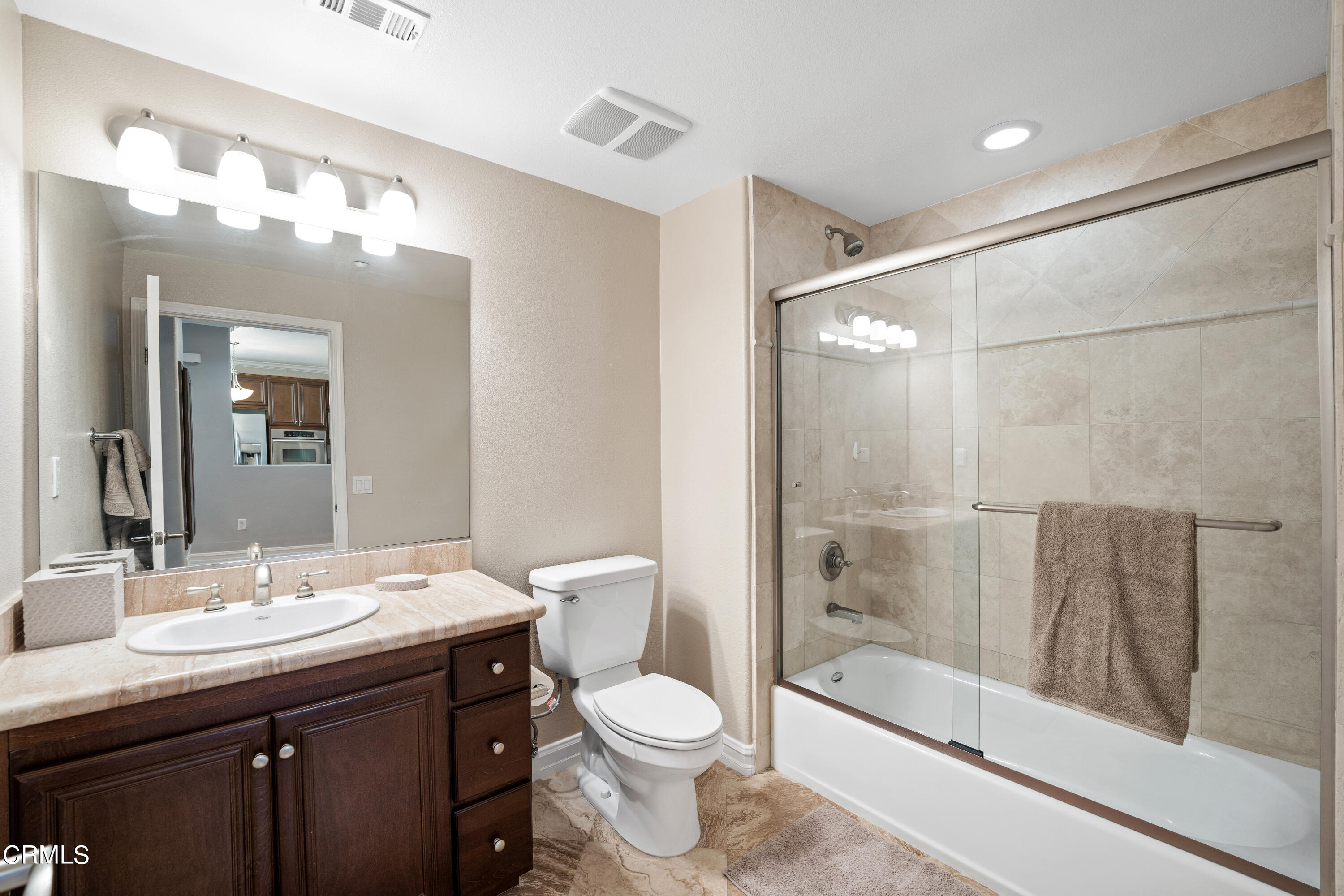 1541 Windshore Way Oxnard, CA 93035 - Photo 19 of 40 a bathroom with a sink a toilet and shower