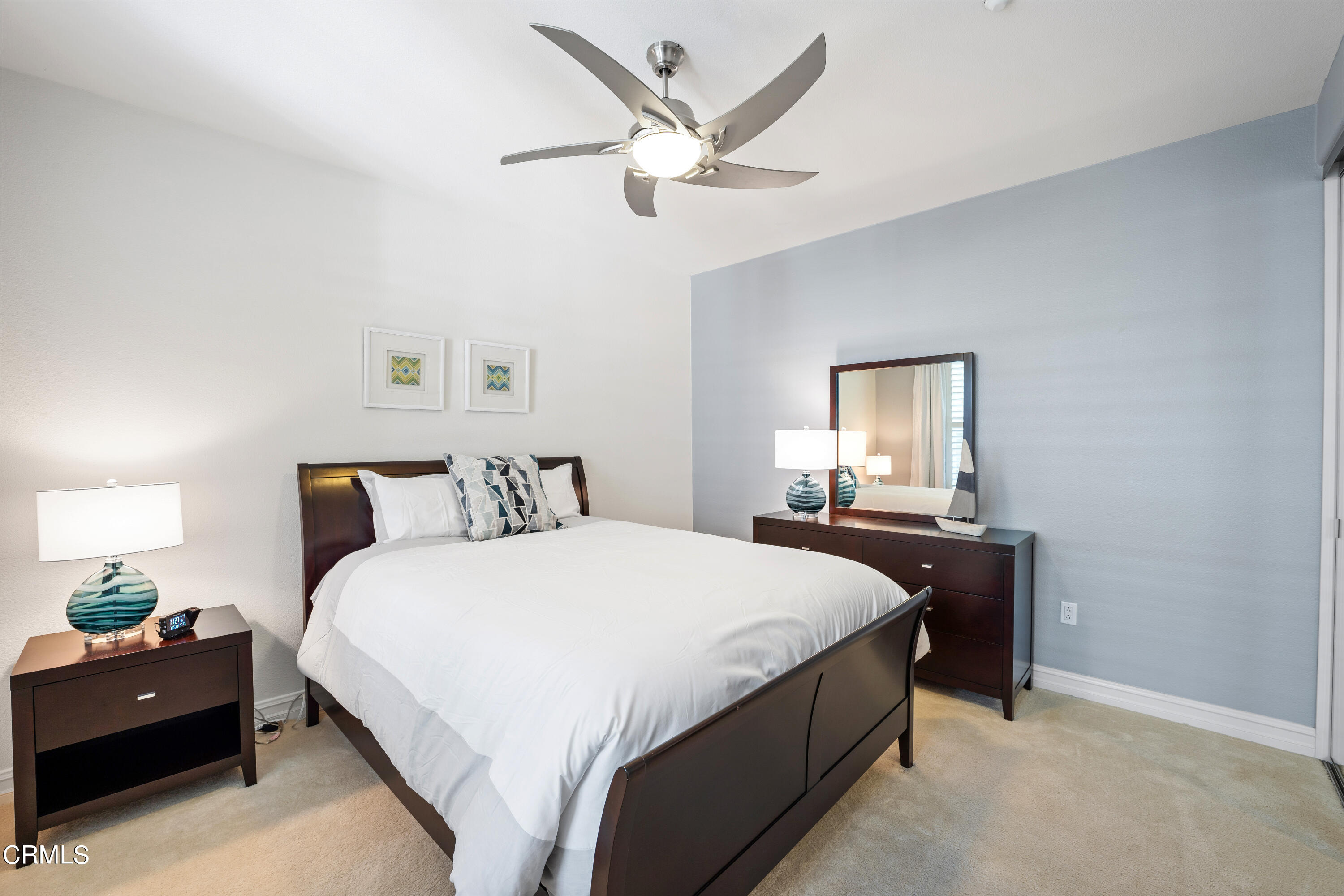 1541 Windshore Way Oxnard, CA 93035 - Photo 20 of 40 a bedroom with bed and a chandelier