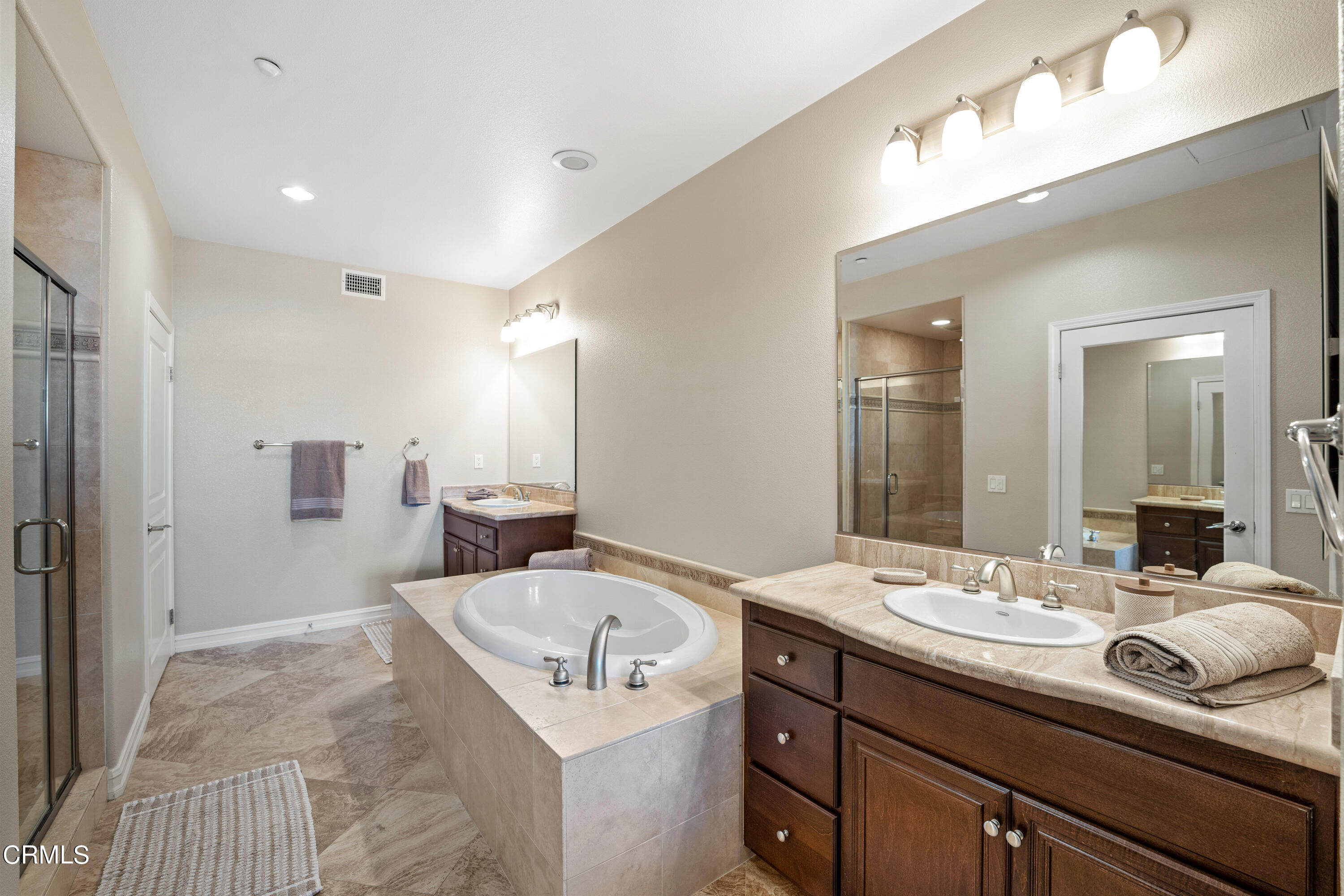 1541 Windshore Way Oxnard, CA 93035 - Photo 24 of 40 a bathroom with a sink double vanity and a mirror