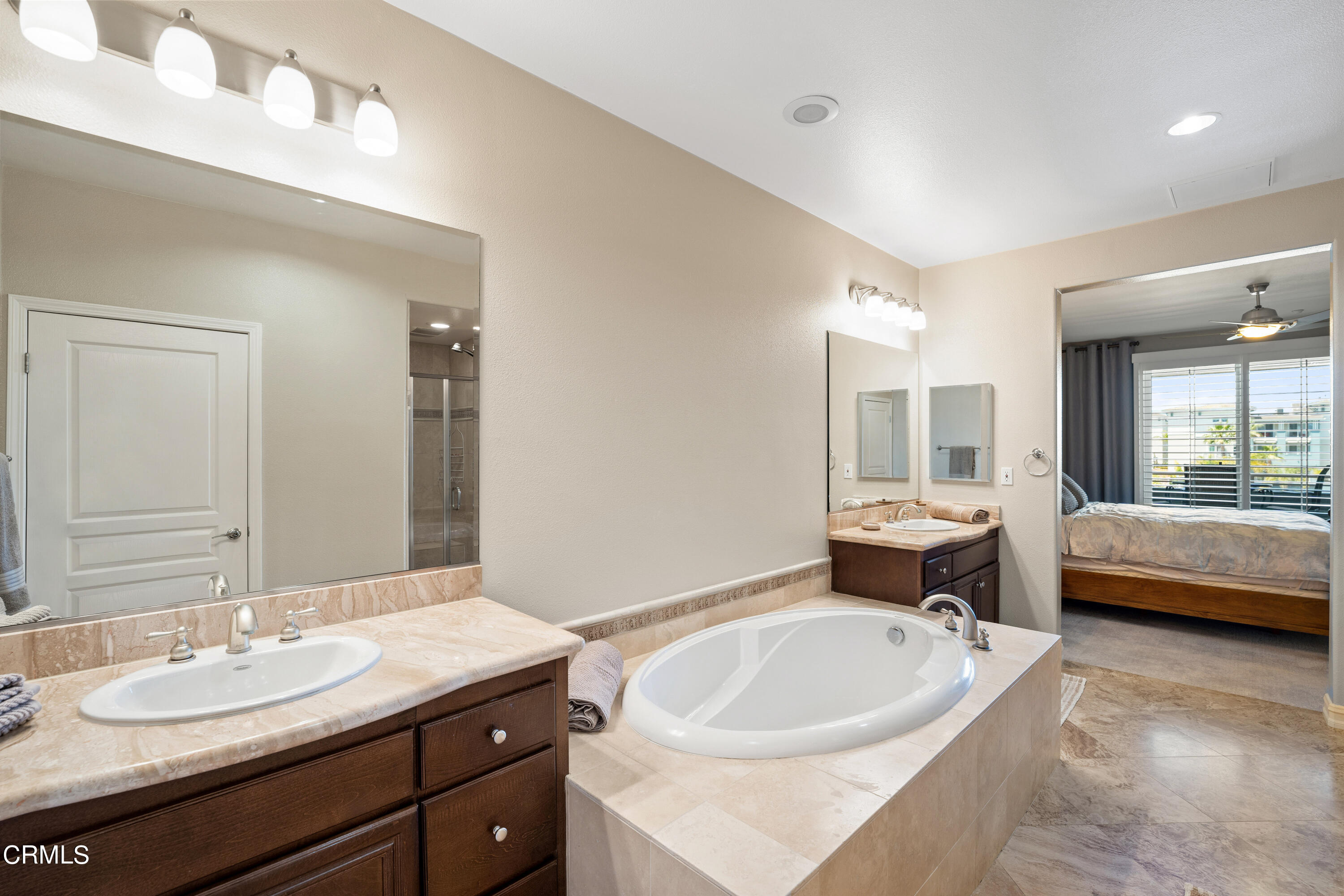 1541 Windshore Way Oxnard, CA 93035 - Photo 25 of 40 a spacious bathroom with a granite countertop sink and a bathtub