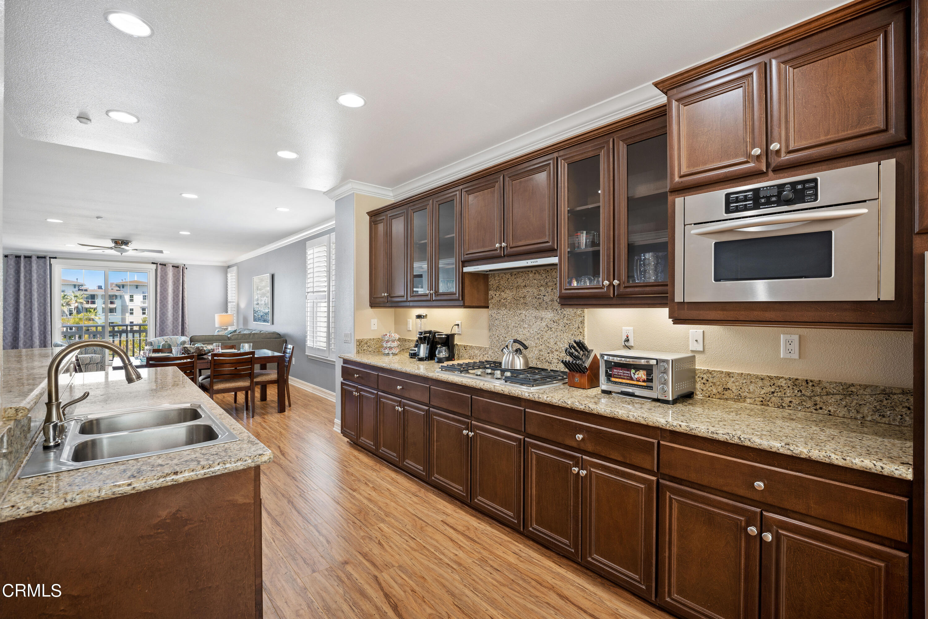 1541 Windshore Way Oxnard, CA 93035 - Photo 3 of 40 a kitchen with stainless steel appliances granite countertop a sink stove and cabinets