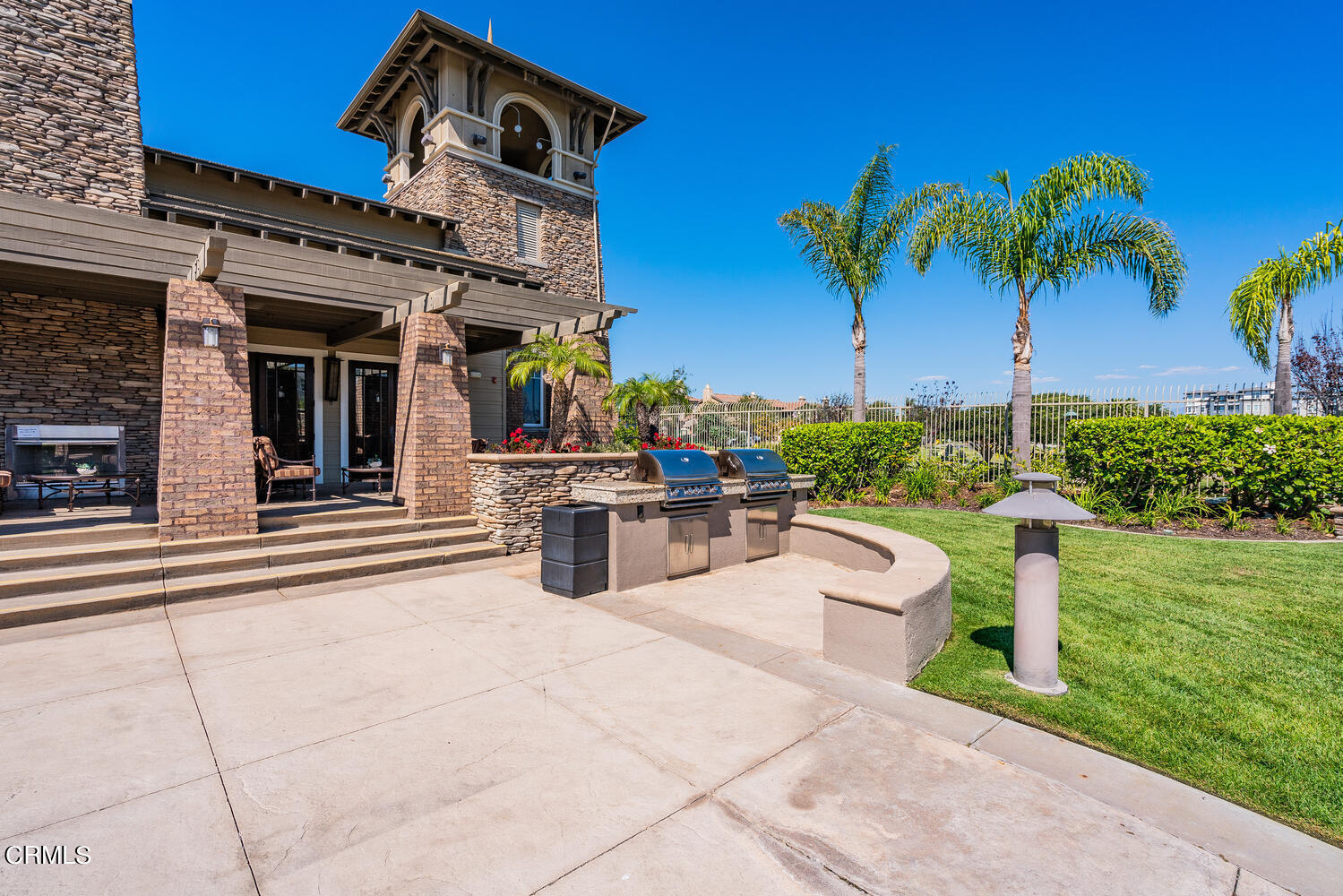 1541 Windshore Way Oxnard, CA 93035 - Photo 34 of 40 a view of a house with a swimming pool and a garden