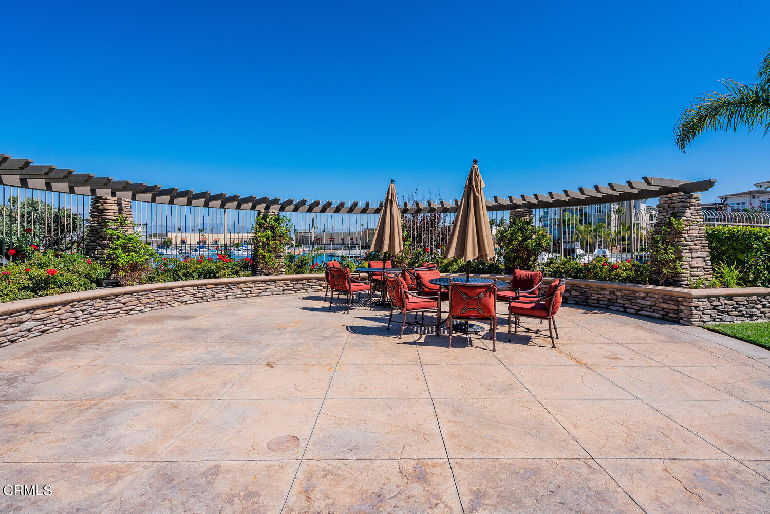1541 Windshore Way Oxnard, CA 93035 - Photo 35 of 40 a view of a patio with a table and chairs