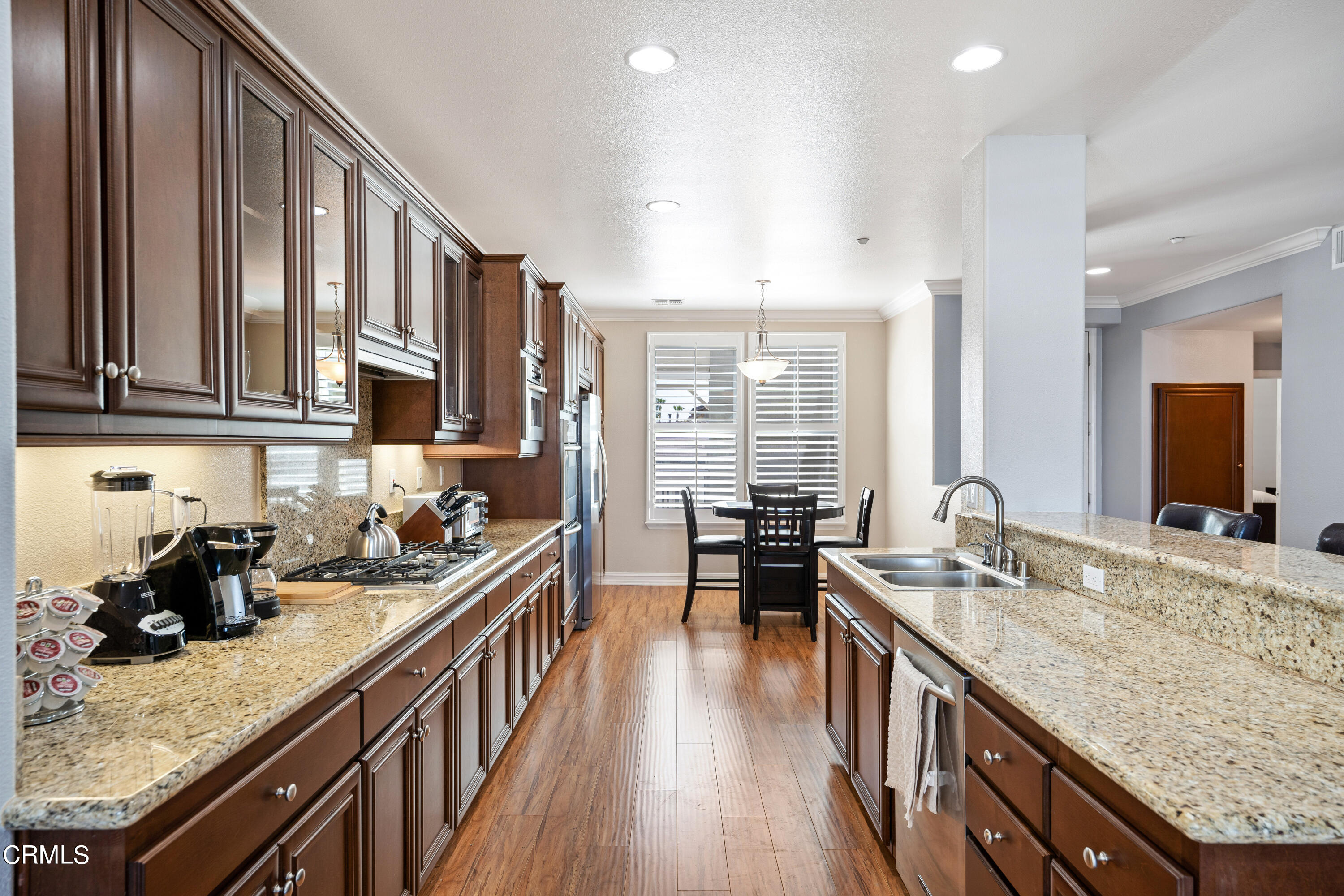 1541 Windshore Way Oxnard, CA 93035 - Photo 5 of 40 a kitchen with stainless steel appliances granite countertop a sink stove and cabinets