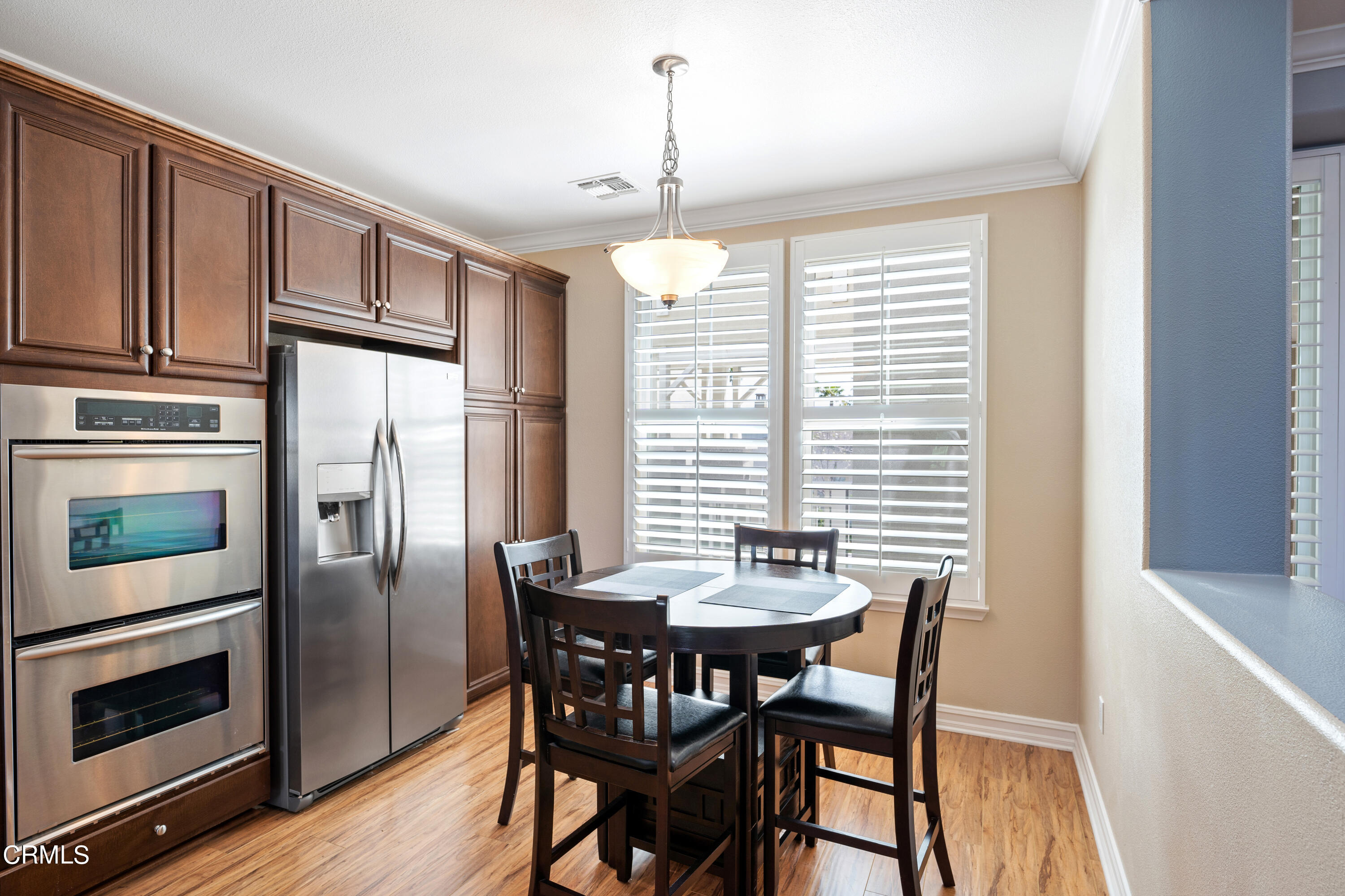 1541 Windshore Way Oxnard, CA 93035 - Photo 8 of 40 a view of a dining room with furniture window and wooden floor