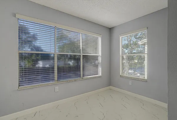 a view of a hallway with a livingroom and fireplace