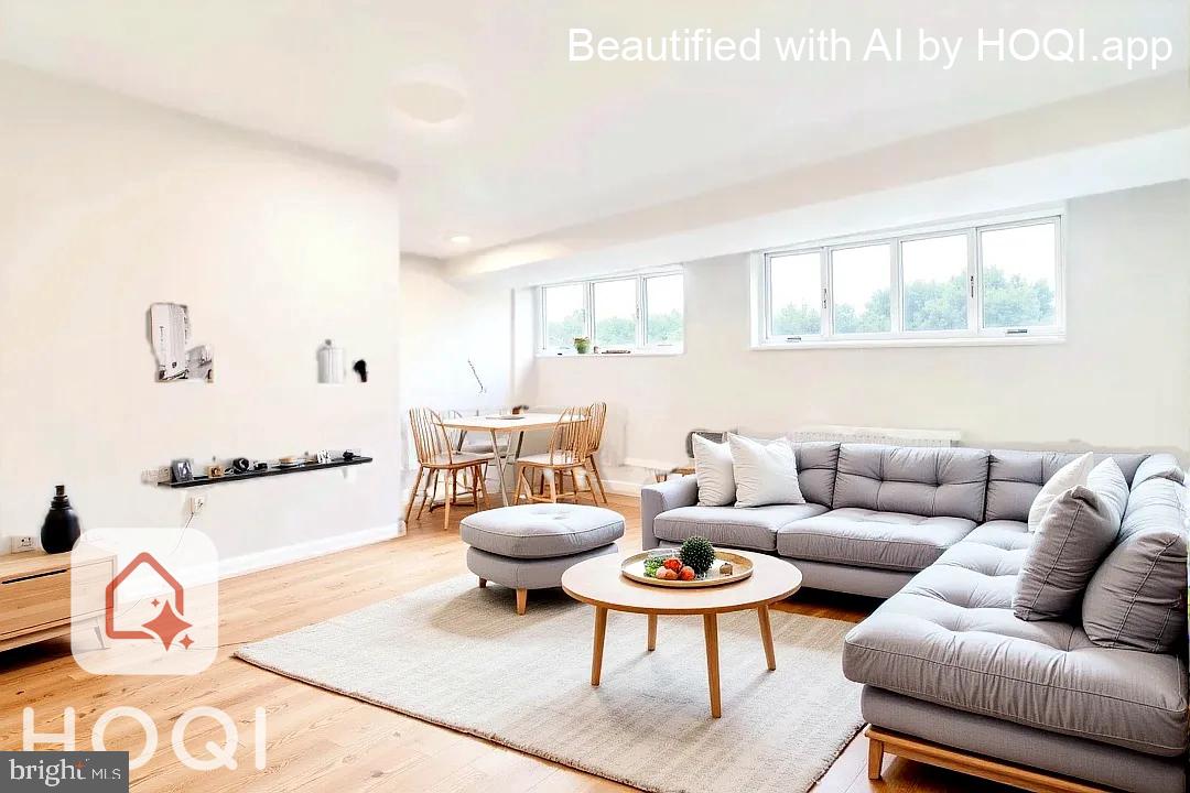 2400 41st Street Northwest, Unit 104 Washington, DC 20007 - Photo 11 of 13 a living room with furniture and a large window