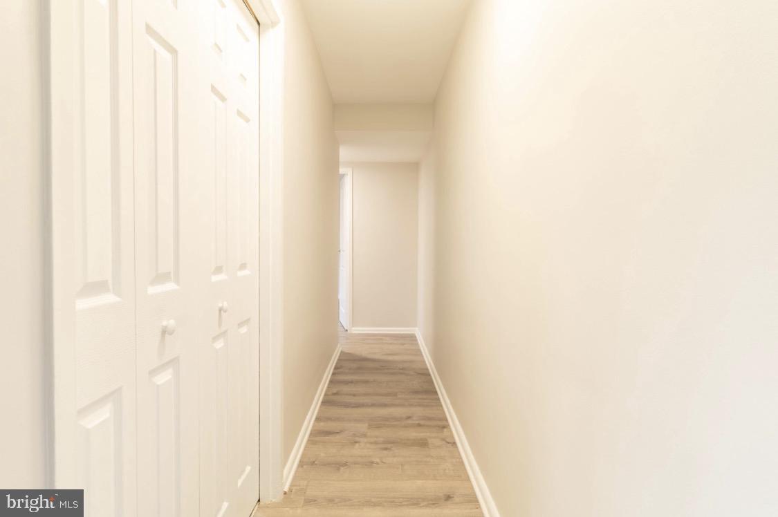 2400 41st Street Northwest, Unit 104 Washington, DC 20007 - Photo 8 of 13 a view of a hallway with white walls