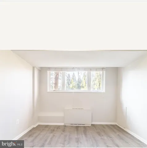 a view of a hallway with white walls