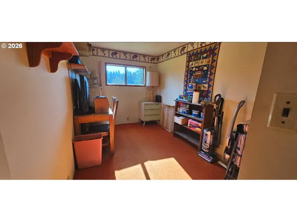a living room with lots of furniture and a book shelf