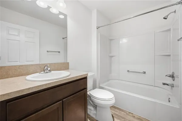 a bathroom with a sink a toilet and a bathtub