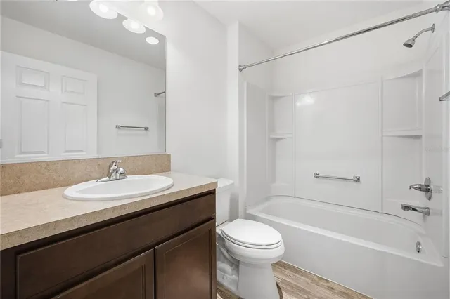 a bathroom with a sink a toilet and a bathtub