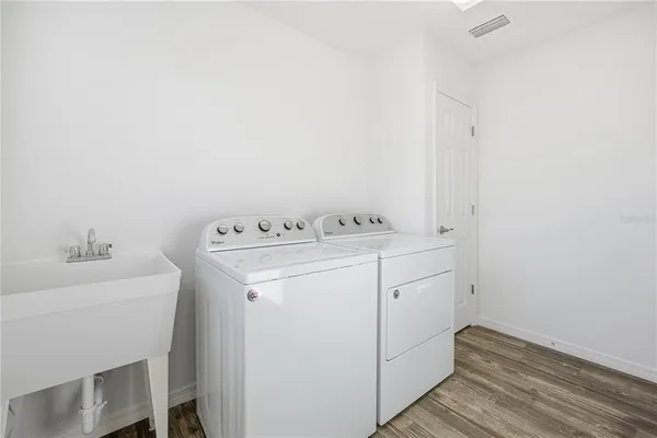 a utility room with dryer and washer