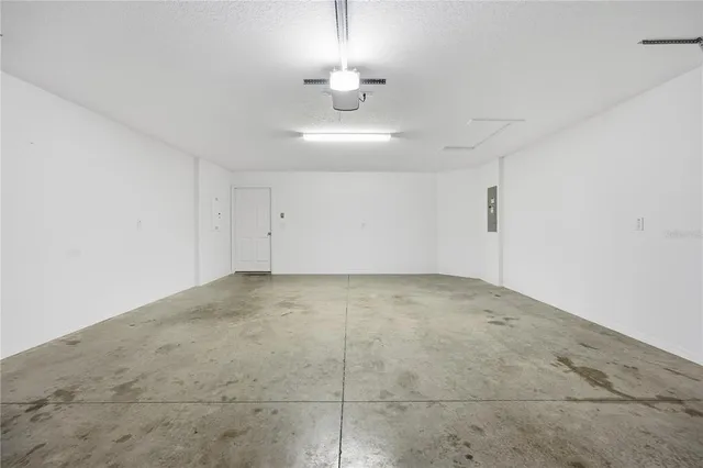 a view of an empty room with a fireplace