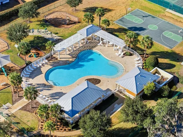 an aerial view of a house with a swimming pool