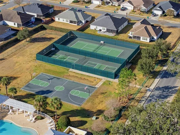 an aerial view of residential houses with outdoor space