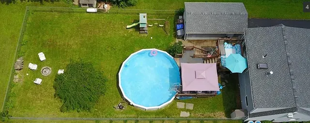 a white toilet sitting next to a bathroom sink and tub