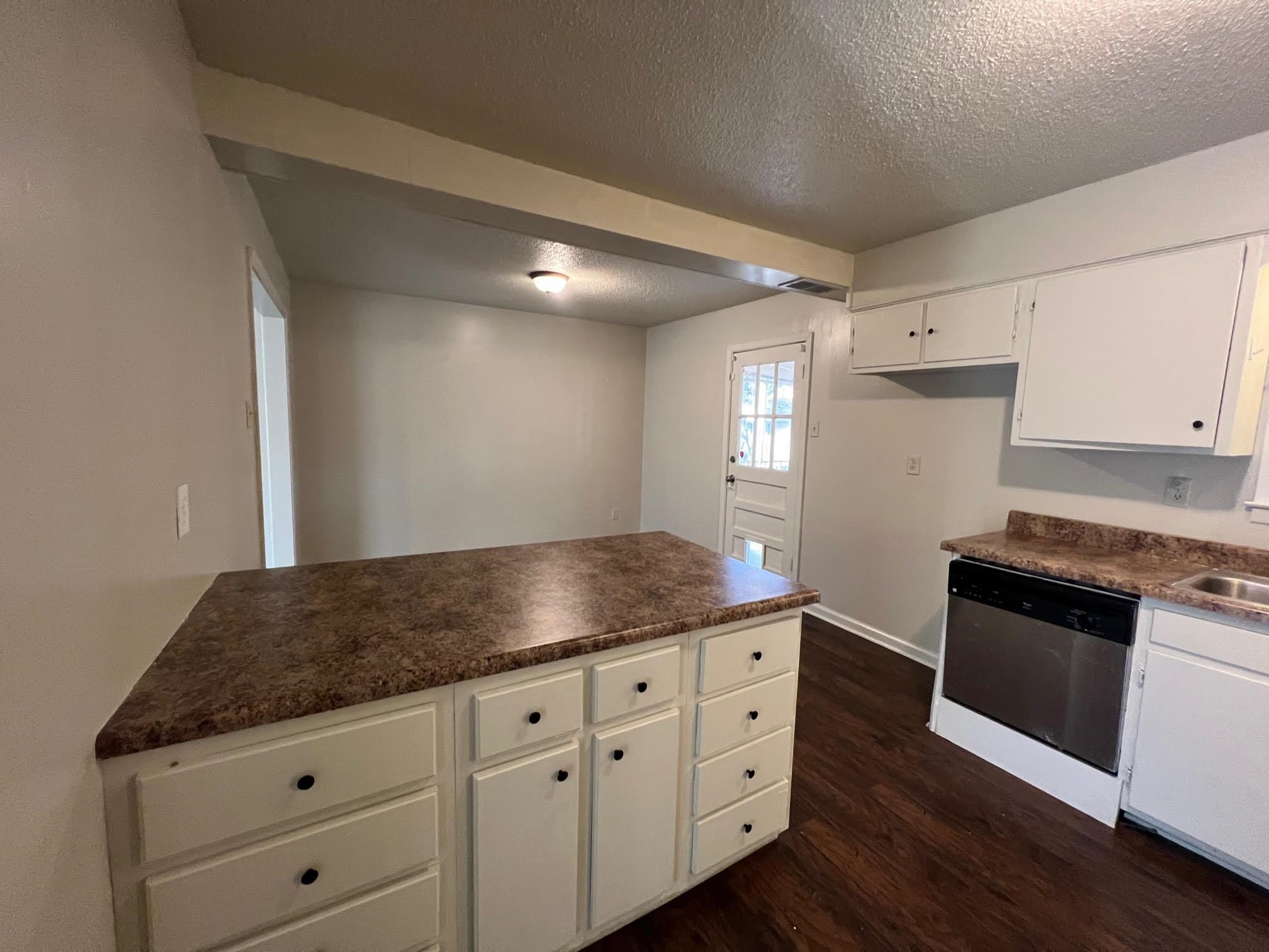 4178 Crain Road Memphis, TN 38128 - Photo 2 of 9 a kitchen with granite countertop white cabinets and stainless steel appliances