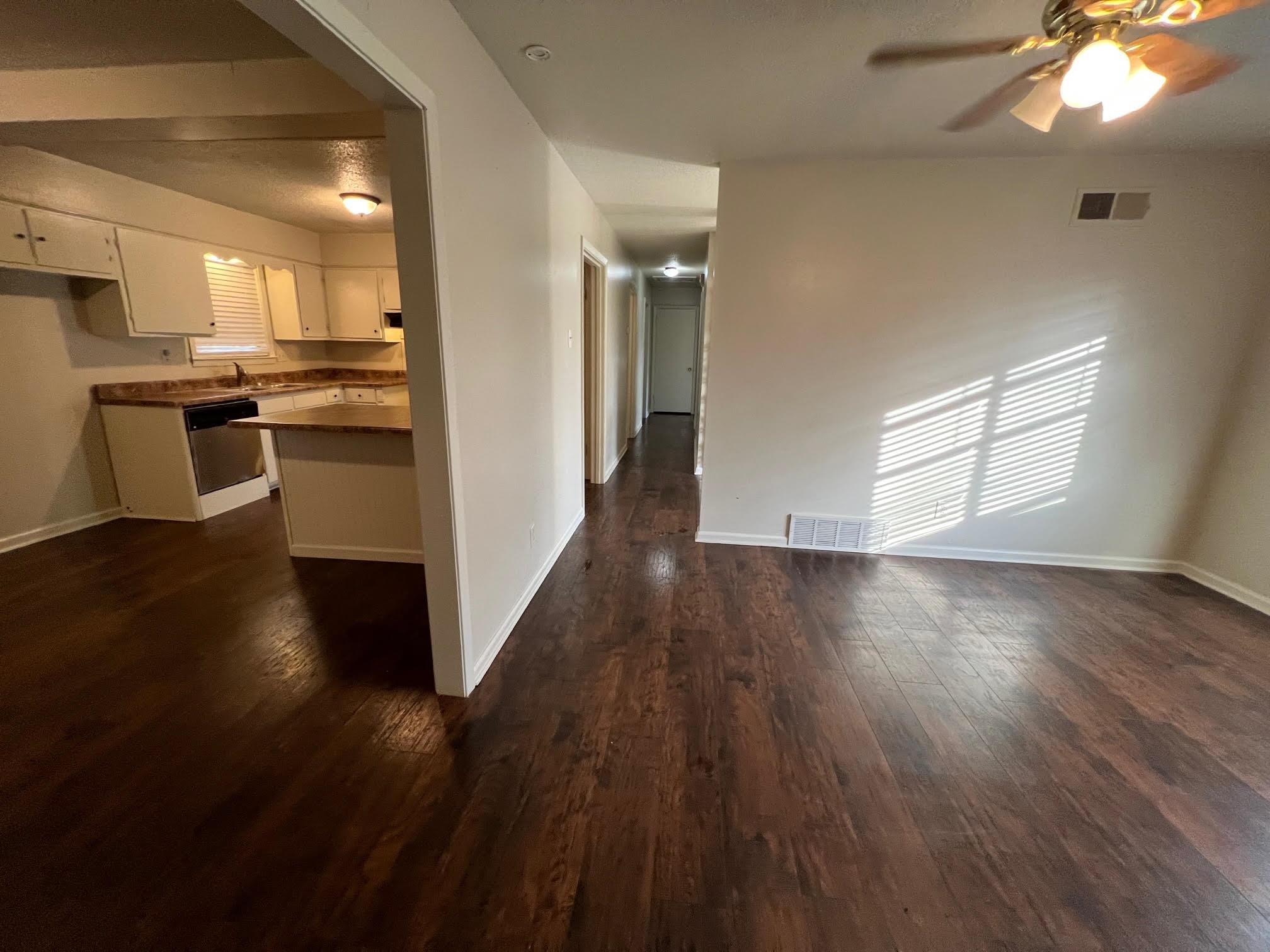 4178 Crain Road Memphis, TN 38128 - Photo 4 of 9 a view of a kitchen with wooden floor and a kitchen