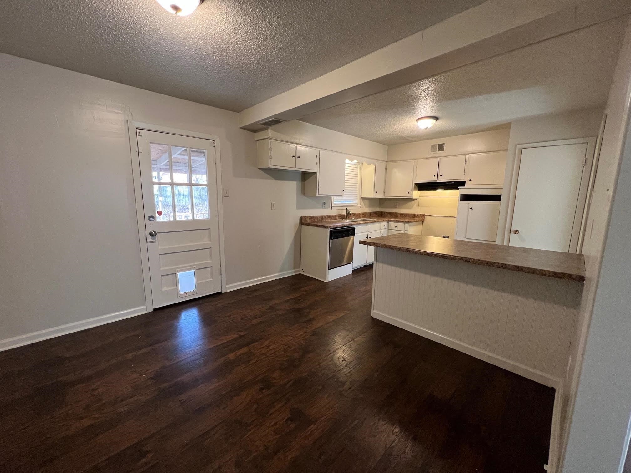 4178 Crain Road Memphis, TN 38128 - Photo 9 of 9 a kitchen with a sink wooden floor and view living room