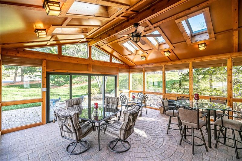 2536 Riva Ridge Court Wexford, PA 15090 - Photo 2 of 25 What a smart design with this vaulted addition that features elevating skylights, dual slider, ceiling fan, and a heat source thanks to the gas heater / stove to allow access year round.
