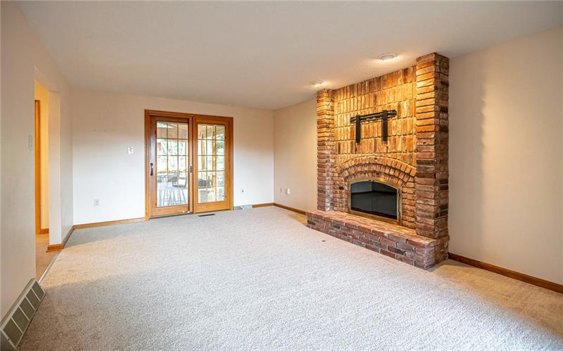 2536 Riva Ridge Court Wexford, PA 15090 - Photo 11 of 25 The floor to ceiling brick fireplace surround houses a lovely updated gas fireplace and the flat screen TV wall mount is ready to go. This allows for easy furniture arrangement in this space! Slider leads to the vaulted addition.