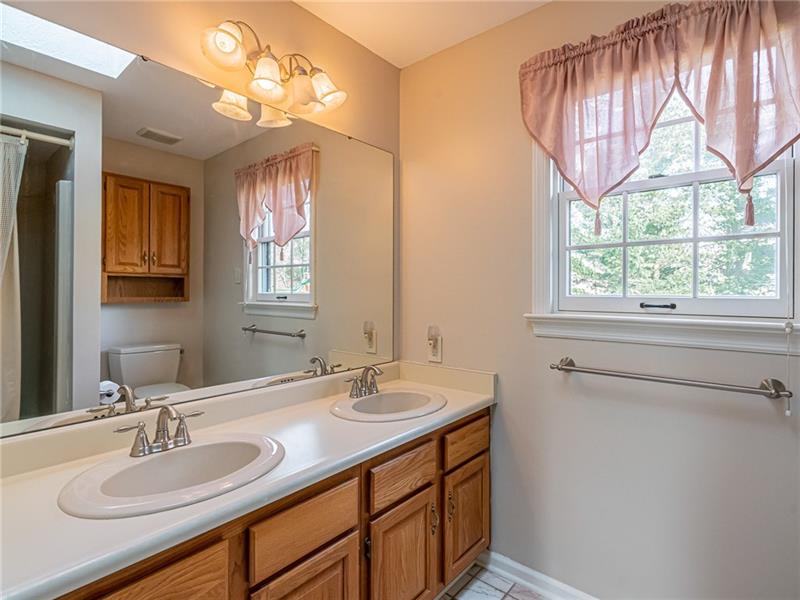 2536 Riva Ridge Court Wexford, PA 15090 - Photo 20 of 25 The guest bathroom features ceramic tile floors and in demand dual vanity. There is a combo tub/shower on the other side of this picture.