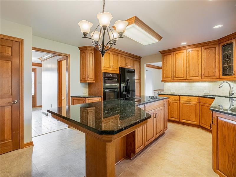 2536 Riva Ridge Court Wexford, PA 15090 - Photo 7 of 25 The extra recessed lights and undercabinet lights shine on the backsplash and granite countertops!