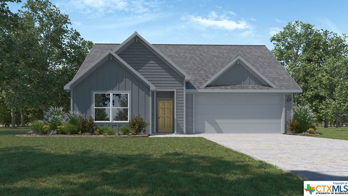 a front view of a house with a garden and plants